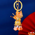 Illuminated Orange Plume Keychain With Pearl and Bead Tassels view 1