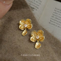 Gold Textured Flower Drop Earrings With Clear Center Stone view 1