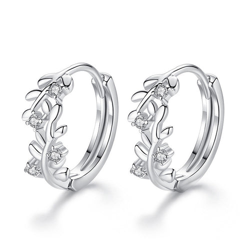Front product view of silver tone leaf vine hoop earrings with clear stone accents