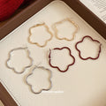 Flower Outline Hoop Earrings in Gold Red and Silver view 4