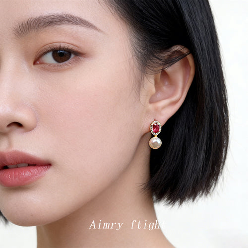 Gold-tone pink-oval-stone white-pearl drops shown worn on an ear.