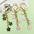 Gold-Tone Initial Letter Keychain With Three Flower Charms view 3