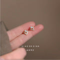 Gold Tone Mini V Pearl CZ Geometric Stud Earrings Pair view 1