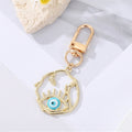 Gold Tone Irregular Openwork and Lash Evil Eye Clip Keychains view 2