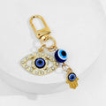 Gold Tone Evil Eye Charm Keychain With Hamsa Hand Accent view 8