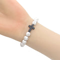 White Cross Bead Stretch Bracelet Black Cross Accent view 2
