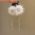 White Faux Fur Pom Pom Pearl and Gold Chain Drop Earrings view 3