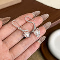 Silver Tone Flower Outline Pearl Look Hook Earrings view 6
