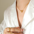 Open Bow Pendant Necklace Gold Steel Polished Metal view 1