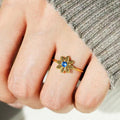 Gold Tone Flower Ring With Blue Center and Green Petals view 3