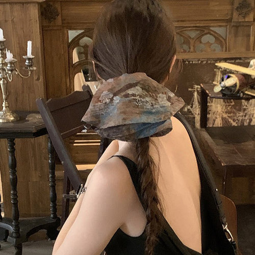 Blue brown floral oversized fabric scrunchie worn on long braided ponytail