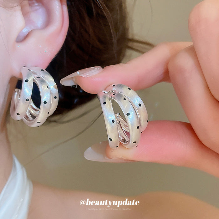 Layered Silver Tone Hoop Earrings with Black Dot Details