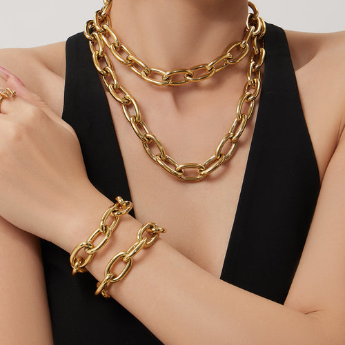 Neckline view of oversized oval link chain jewelry in main image 2.