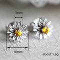 Sculpted Sunflower Clear Stone Stud Earrings In Two Metal Tones view 4