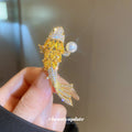 Gold Tone Crystal Fish Brooch With Pearl Like Orb Detail view 3