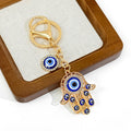 Hamsa Hand and Evil Eye Charm Keychain in Gold and Silver Tone view 6