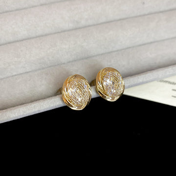 Textured Oval Dome Clip On Earrings In Two Tones With Polished Metal Details