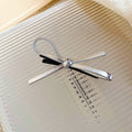 Silver Bow Duckbill Hair Clip With Unlisted Black Version In Main Gallery view 6