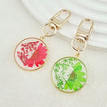 Gold Tone Round Pressed Daisy Resin Clip Keychains view 3