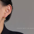Pavé CZ Bow Huggie Hoop Earrings Gold and Silver Tones view 3