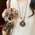 Long Cord Pendant Necklace in Six Wood and Metal Designs view 1
