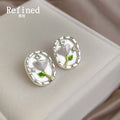 Clear Oval Dome White Tulip And Green Stem Stud Earrings view 1