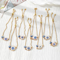 Gold Tone Blue Evil Eye Double-Dangle Slider Bracelets in Eight Designs view 2