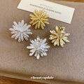 Radiating Textured Flower Clip On Earrings In Two Tones view 4