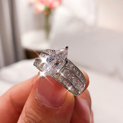 Second product view showing silver-tone marquise solitaire triple-row wide ring