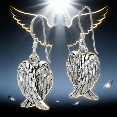 Front view of textured angel wing drop earrings in antique silver tone