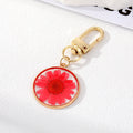 Gold Tone Pressed Flower Resin Clip Keychains in Eight Round and Irregular Designs view 8