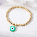 Gold Tone Bead Stretch Bracelets with Round Evil Eye Charms view 6