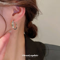 Silver Tone Rounded Hoop Earrings With Polished Metal Tone Details view 3