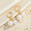 Gold Tone Double Faux Pearl Huggie Drop Earrings in Graduated Sizes view 1