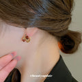 Gold Tone Twisted Hoop Earrings With Faceted Brown Square Stones view 4