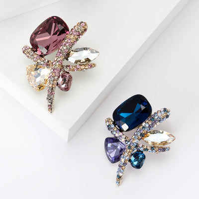 Front view of geometric Crystal Dragonfly Brooch in Pink or Blue against a white background.