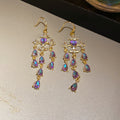 Gold Tone Starburst Chandelier Earrings In Three Colors view 7