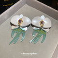 White Orchid Drop Earrings with Green Swallow Shaped Dangles view 4