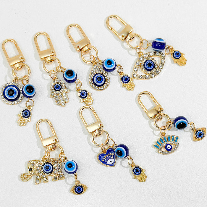 Gold Tone Evil Eye Charm Keychain With Hamsa Hand Accent