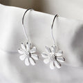 White Gold Daisy Flower Hook Earrings Textured Center Detail view 4