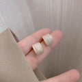 Gold Cream Swirl Square Stud Earrings Soft Gloss Finish view 2