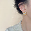 Gold Textured Flower Pearl Stud Earrings Crystal Accent view 2