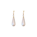 White Teardrop Dangle Earrings In Gold And Silver With Decorative Details view 5