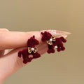 Red Flocked Horse Bow Stud Earrings with Distinctive Textured Details view 6