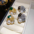Mixed Metal Floral Stud Earrings With White Pearl Centers view 1