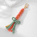 Gold Tone Woven Daisy Bow Tassel Clip Keychains in Four Colors view 7
