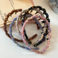 Seven Wrapped And Plain Wavy Tooth Headbands In Black White Brown And Blue view 4