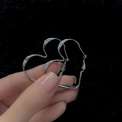 Geometric Hoop Earring selection in Gold and Silver Tone shown in ear-worn front view