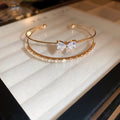 Double Band Bow Open Bangle In Iridescent Gold Gold Or Silver Tone view 7