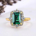 Emerald Green Rectangular Clear Stone Halo Ring In Gold Tone view 2